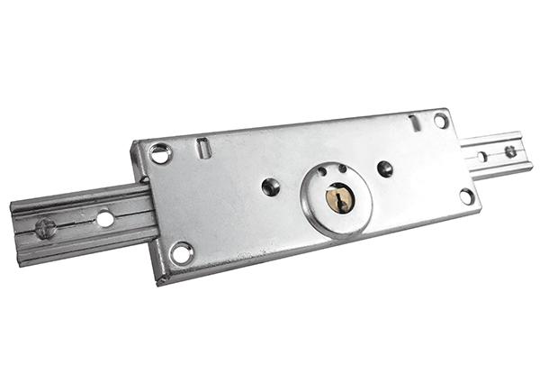 Serrure centrale pour porte enroulable / rideau